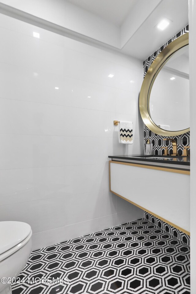 bathroom featuring tile patterned flooring and toilet