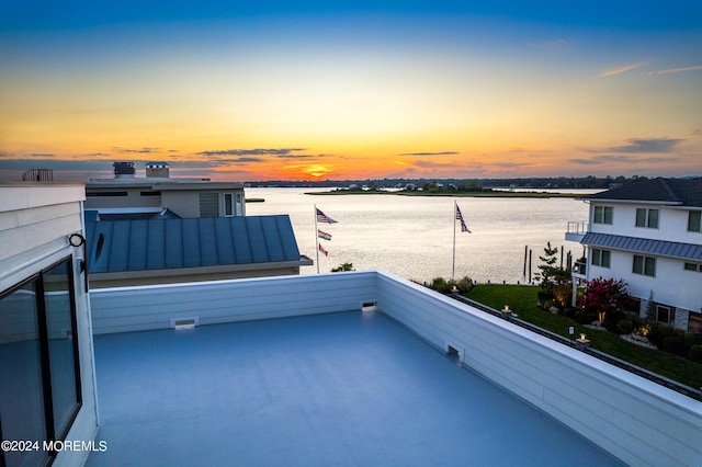 balcony at dusk with a water view