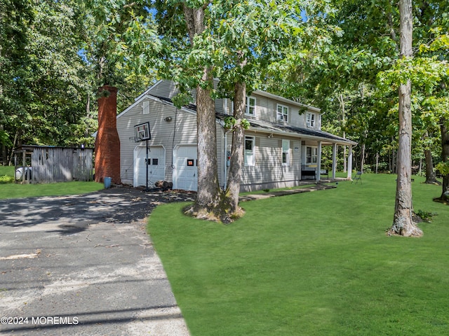 view of front property with a front yard and a garage