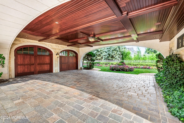 exterior space featuring ceiling fan and wood ceiling