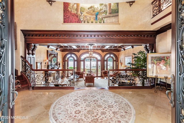 entrance foyer featuring a high ceiling and light tile patterned floors