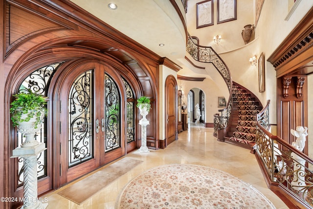 tiled foyer entrance featuring french doors