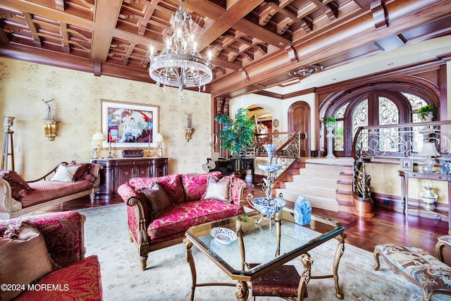 living room featuring beam ceiling, a notable chandelier, crown molding, and coffered ceiling