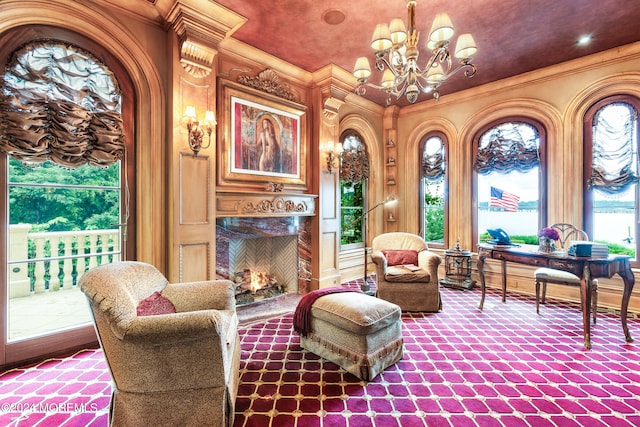 sitting room with an inviting chandelier and ornamental molding