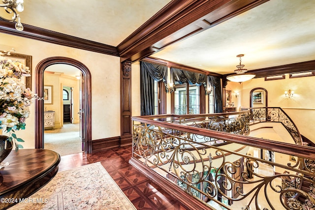 hall featuring dark colored carpet and ornamental molding