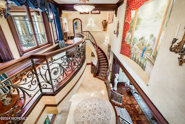 hallway featuring crown molding and tile patterned flooring