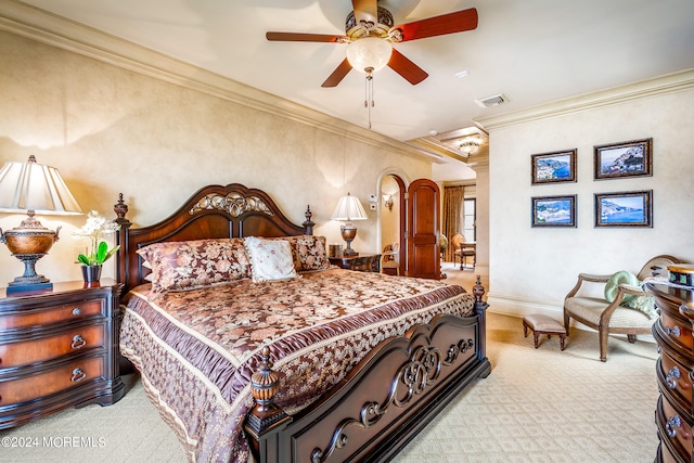 carpeted bedroom featuring ceiling fan and ornamental molding