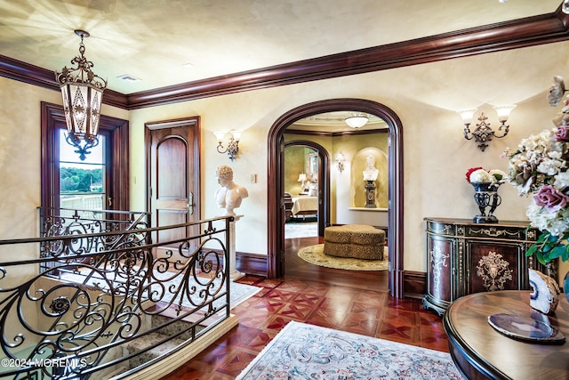 hall with parquet flooring and ornamental molding