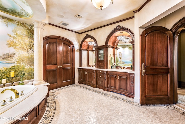 bathroom with vanity, ornamental molding, tile patterned floors, ornate columns, and a washtub