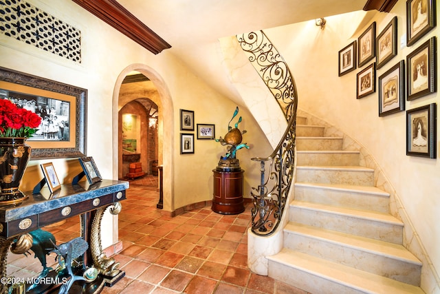 staircase featuring tile patterned flooring