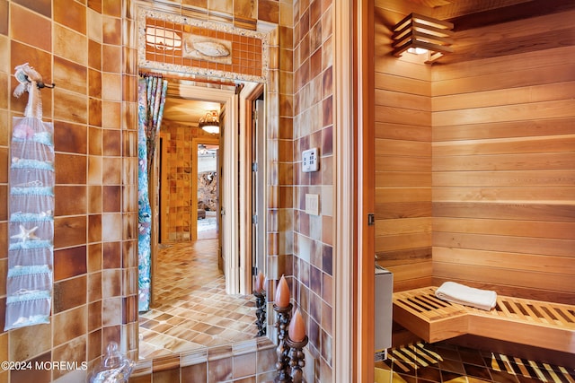 view of sauna / steam room with wooden walls