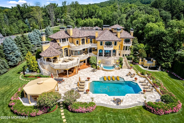 view of swimming pool with a patio and a yard