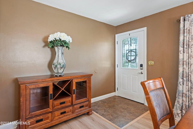 foyer entrance with light wood-type flooring