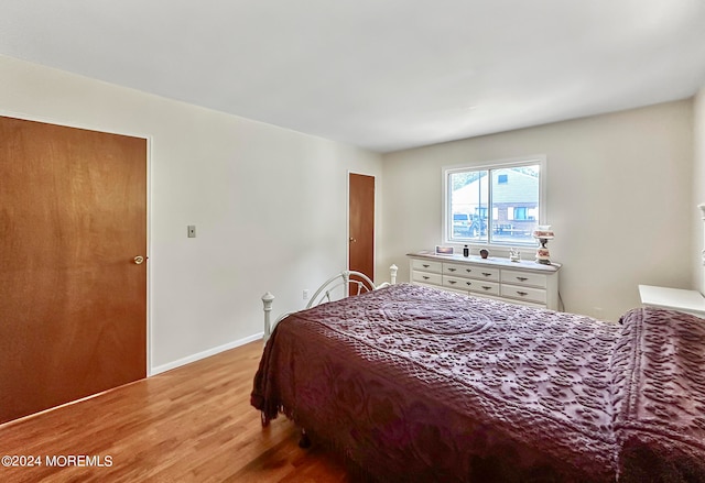 bedroom with light wood-type flooring