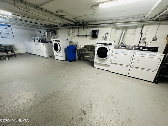 unfinished basement featuring washing machine and dryer