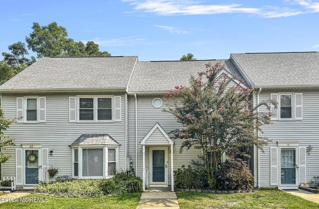 view of property with a front lawn