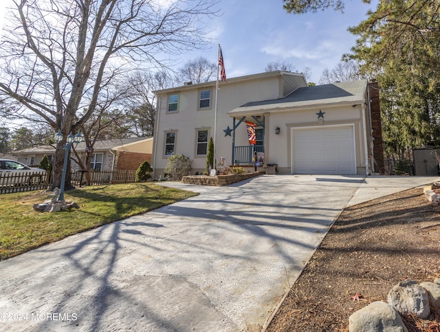 front facade featuring a garage and a front yard