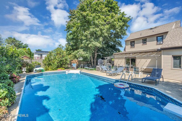 view of pool featuring a patio area