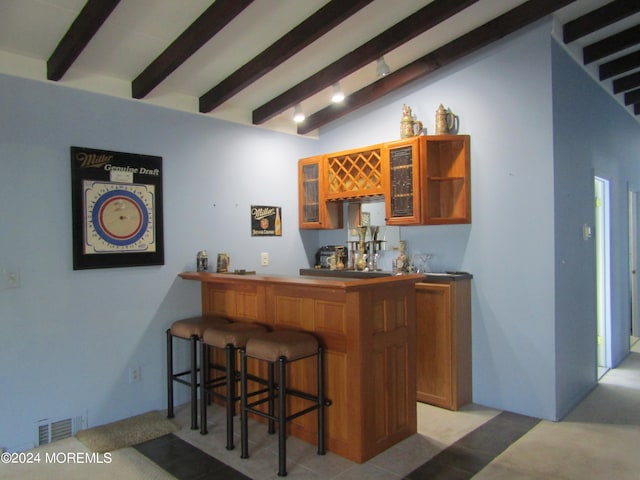 bar with vaulted ceiling with beams