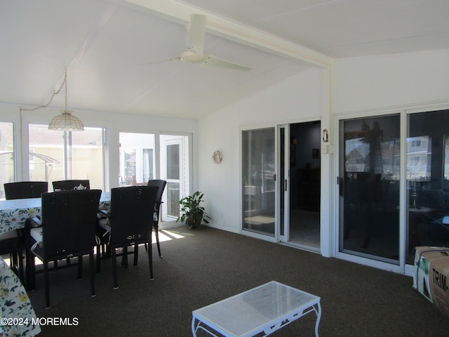 sunroom featuring vaulted ceiling with beams and ceiling fan