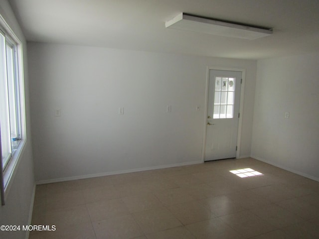 unfurnished room featuring a healthy amount of sunlight