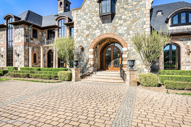 86 Montrose Rd, Colts Neck, NJ 07722 - exterior space featuring a high end roof, stone siding, and french doors
