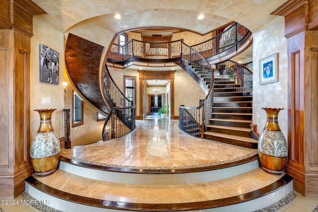 interior space featuring a towering ceiling