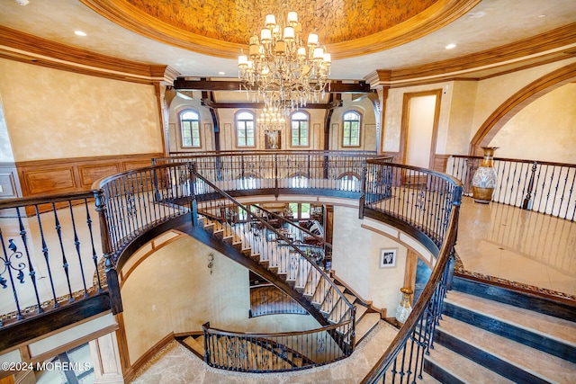 86 Montrose Rd, Colts Neck, NJ 07722 - stairs with a tray ceiling, wainscoting, crown molding, and a chandelier