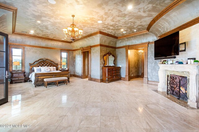 bedroom featuring a high end fireplace, crown molding, and a notable chandelier