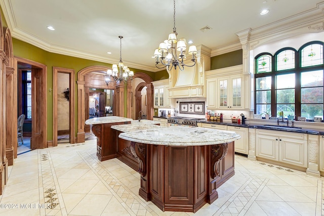 86 Montrose Rd, Colts Neck, NJ 07722 - kitchen featuring cream cabinets, a sink, an inviting chandelier, and a kitchen island