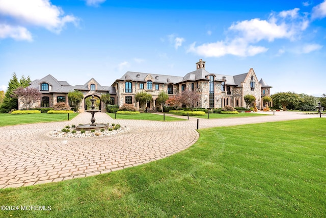 86 Montrose Rd, Colts Neck, NJ 07722 - view of front of home with stone siding, curved driveway, a high end roof, and a front lawn