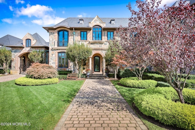 86 Montrose Rd, Colts Neck, NJ 07722 - french country inspired facade with stone siding, a high end roof, and a front lawn