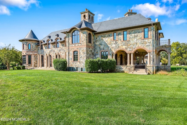 86 Montrose Rd, Colts Neck, NJ 07722 - rear view of property featuring stone siding, a chimney, and a lawn