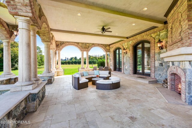 view of patio / terrace featuring an outdoor living space and ceiling fan