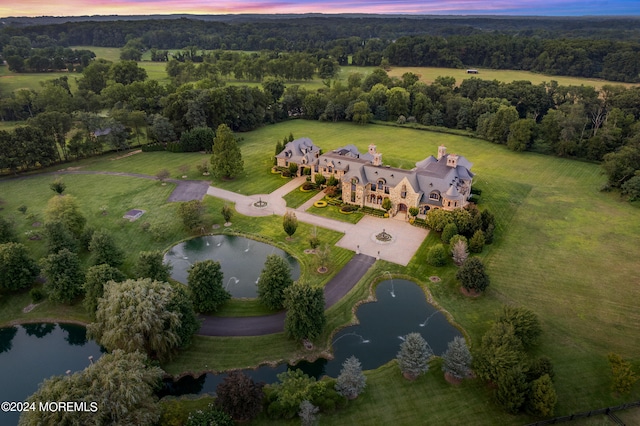 aerial view at dusk with a water view