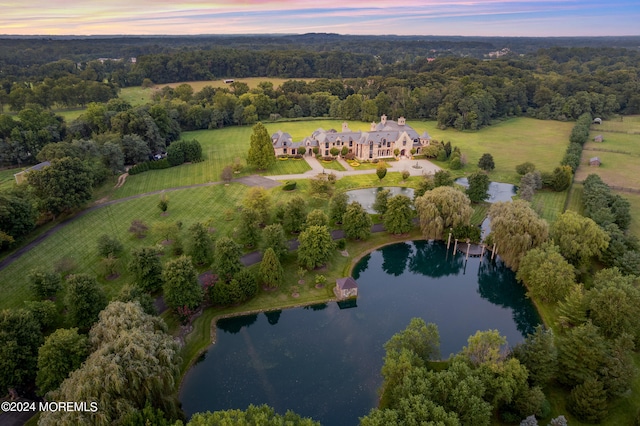 aerial view at dusk with a water view