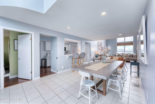 dining room featuring light tile patterned floors, visible vents, baseboards, and recessed lighting