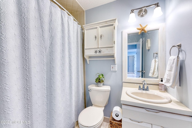 bathroom featuring toilet, a shower with shower curtain, a textured ceiling, and vanity