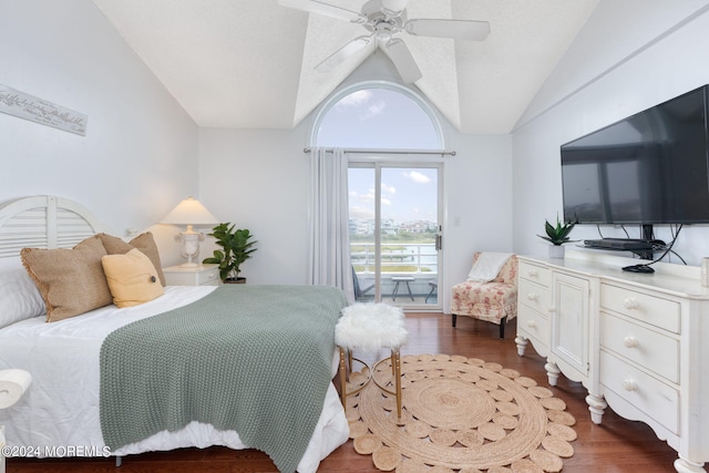 bedroom featuring vaulted ceiling, access to outside, dark wood-style floors, and a ceiling fan