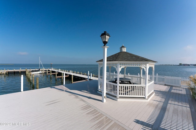 dock area with a gazebo and a water view