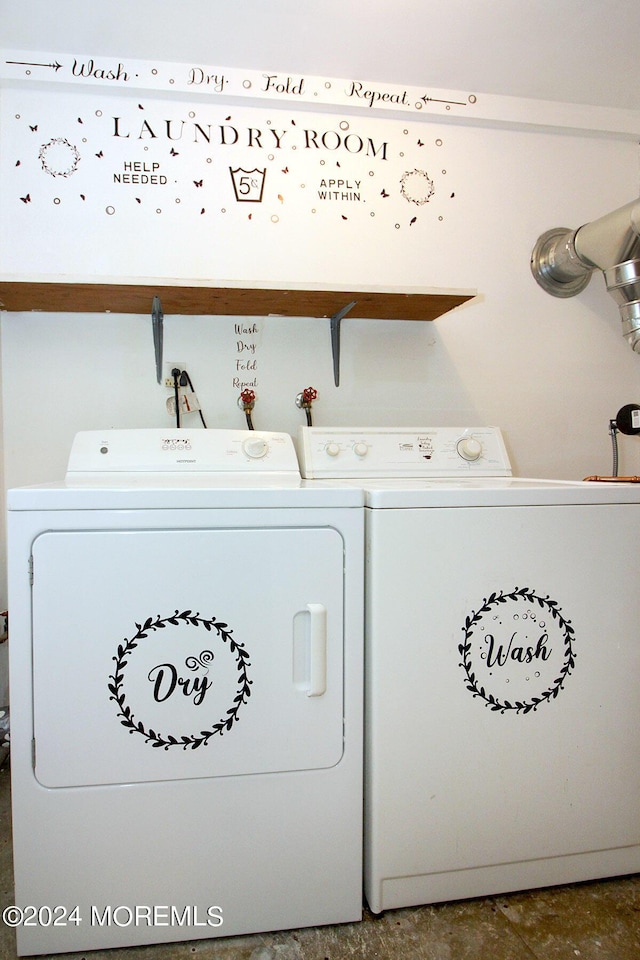 clothes washing area with washer and dryer and laundry area