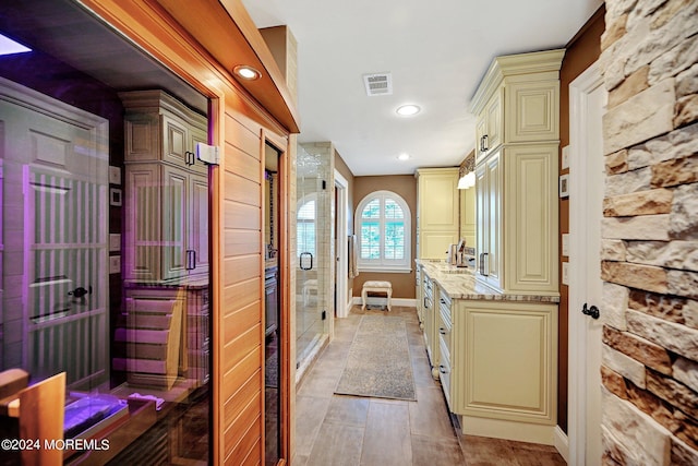 full bath featuring recessed lighting, vanity, visible vents, baseboards, and a shower stall