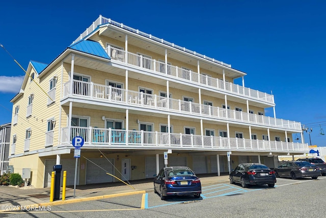 view of building exterior with uncovered parking