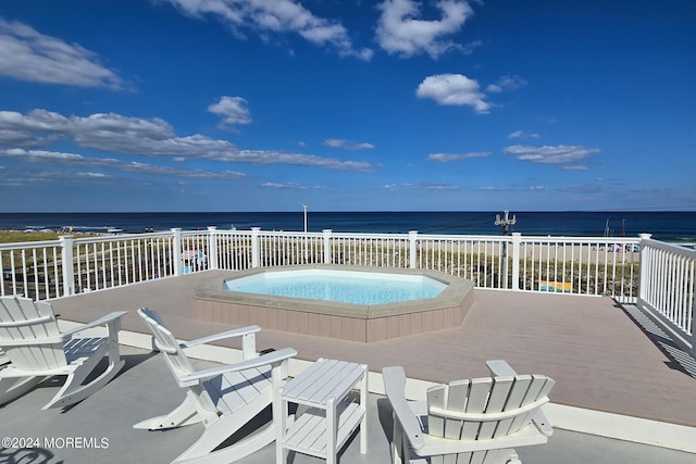 view of swimming pool with a water view and a pool