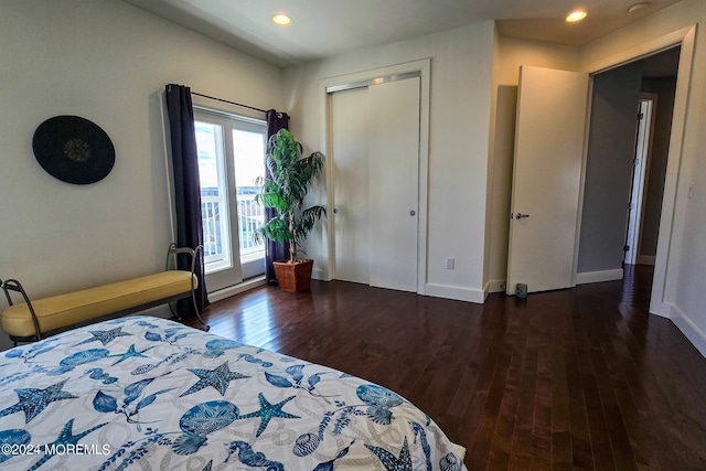 bedroom featuring a baseboard heating unit, recessed lighting, wood finished floors, and baseboards