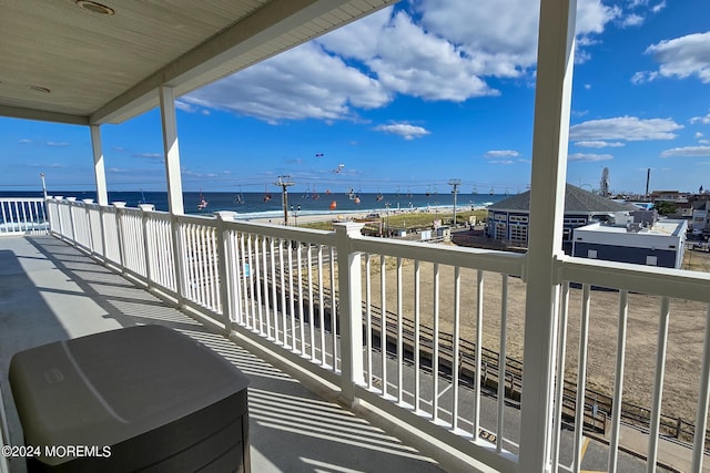 balcony featuring a water view