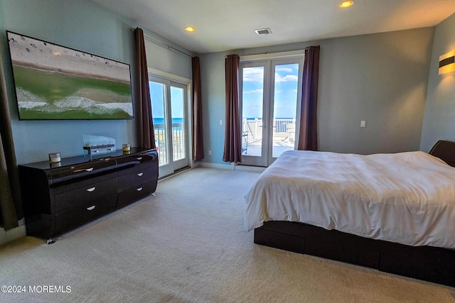 bedroom featuring access to exterior, baseboards, light carpet, recessed lighting, and french doors