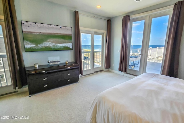 bedroom with baseboards, light colored carpet, and access to outside