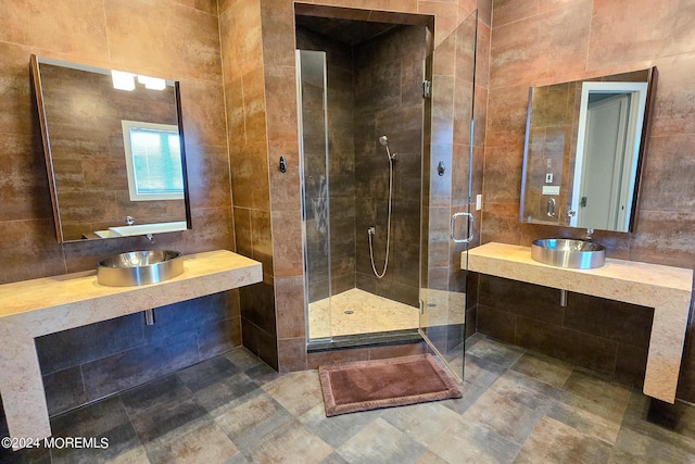 full bath featuring a stall shower and a sink