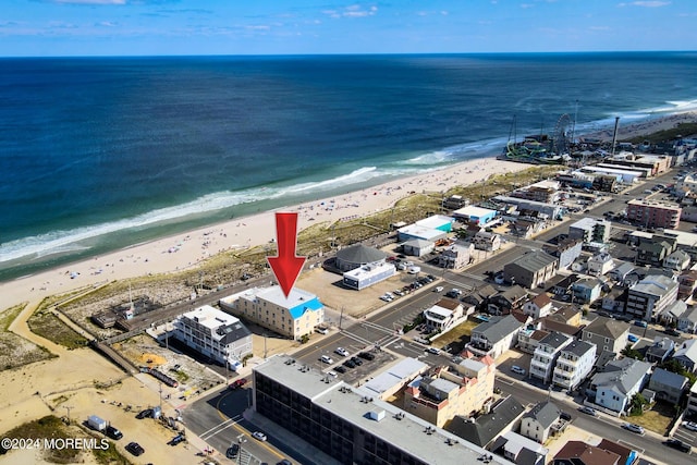 drone / aerial view with a view of the beach and a water view